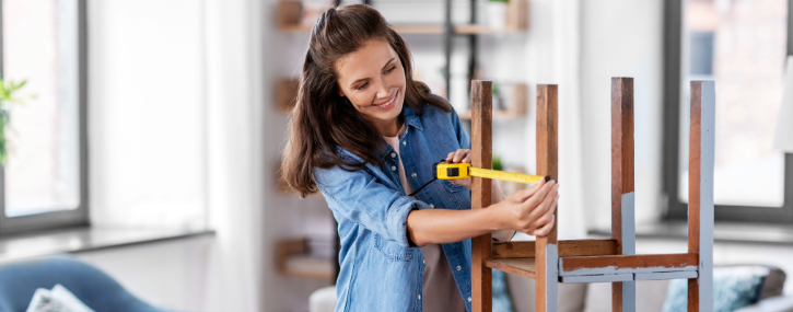 image of a woman measuring an item