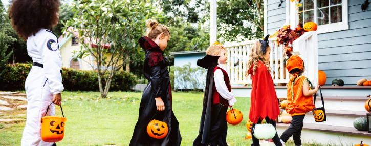 Trick-or-Treaters approach a home to collect their halloween treats