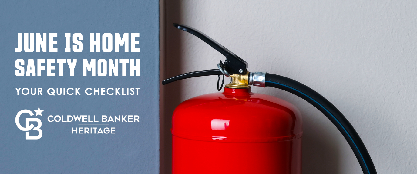 Red fire extinguisher against wall with text “June is Home Safety Month – Your Quick Checklist” and Coldwell Banker Heritage logo, promoting a home safety checklist