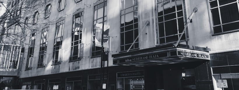Hilton Netherland Plaza Art Deco hotel entrance and marquee on a downtown Cincinnati street.