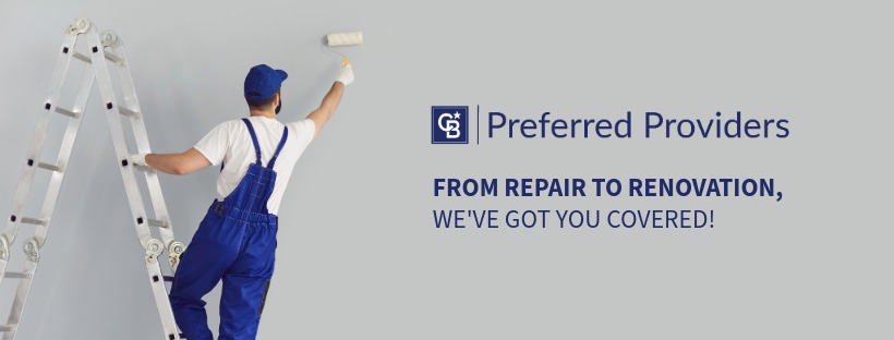 A home-service painter uses a roller to paint an interior wall beside the CB Preferred Providers logo, representing trusted renovation professionals.